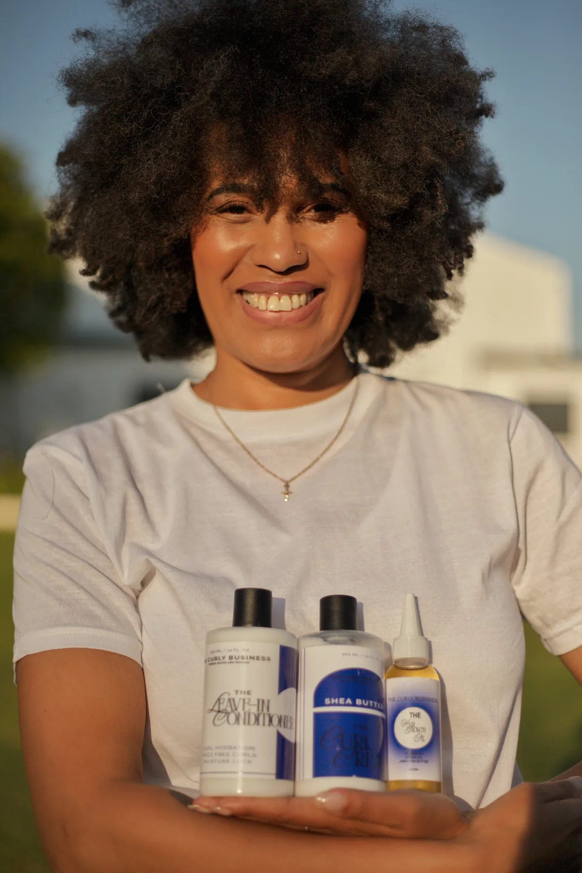 Friends laughing together at The Curly Business photo shoot