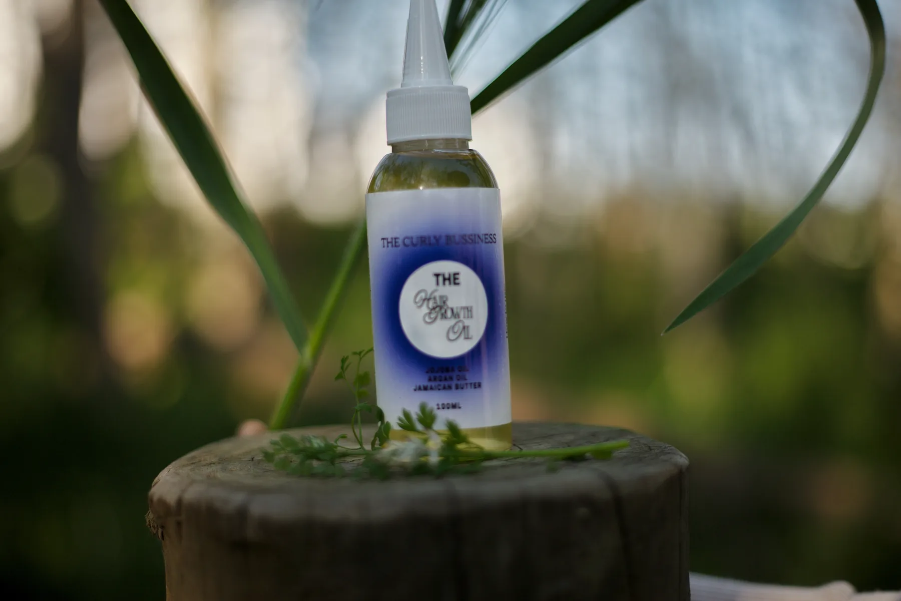 The Curly Business Hair Growth Oil bottle