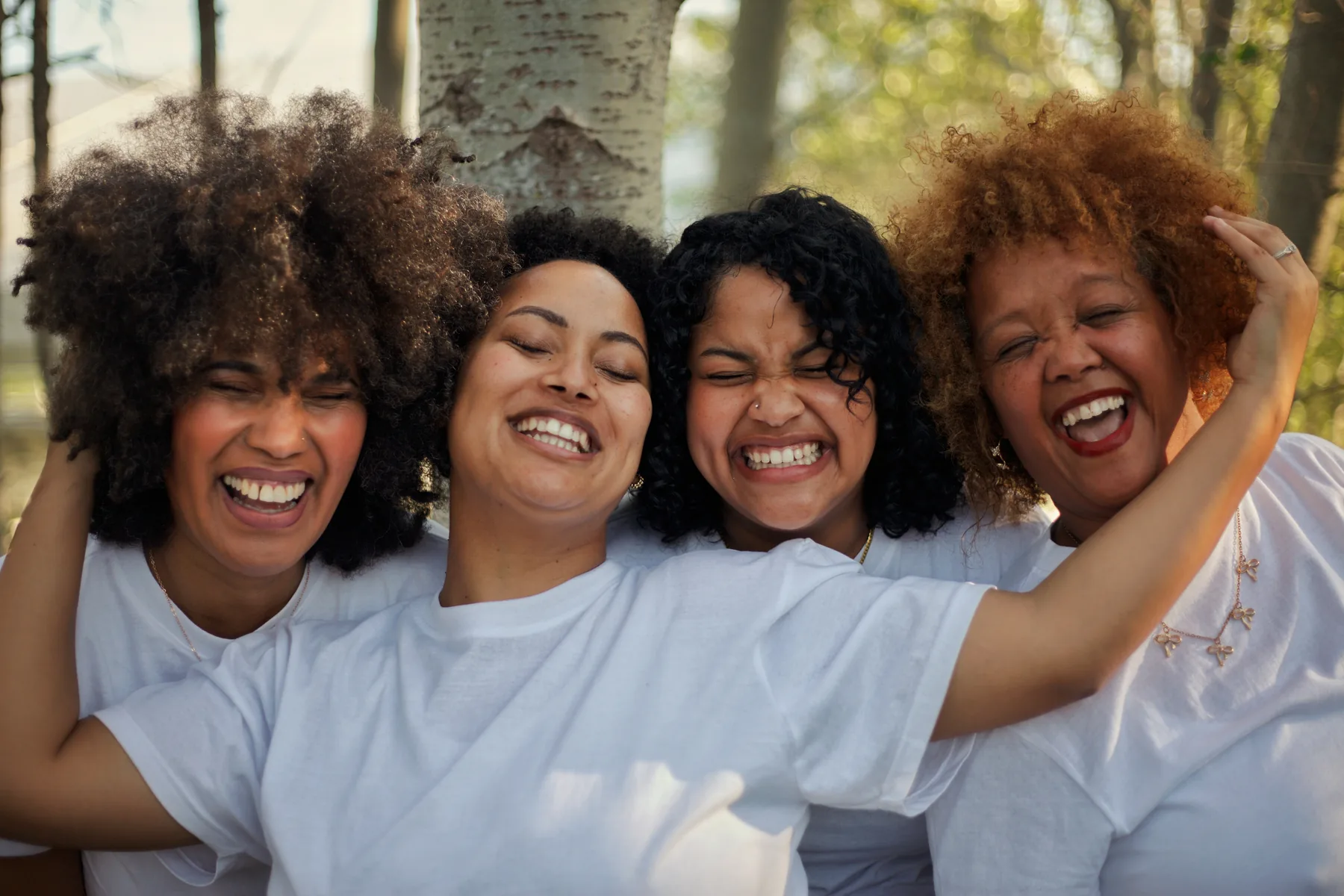 Women celebrating their natural curls together
