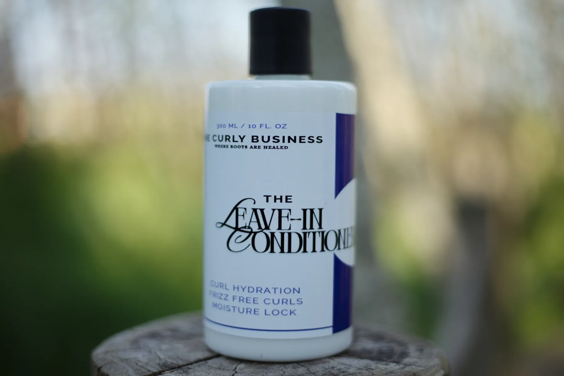 The Curly Business Leave-In Conditioner bottle